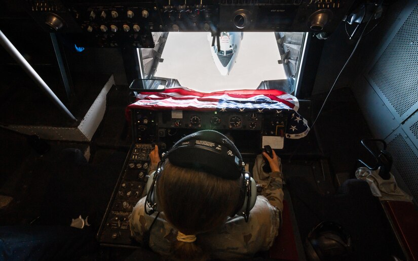 U.S. Air Force Airman 1st Class Lauren Hotaling, 908th Expeditionary Air Refueling Squadron in-flight refueling specialist, refuels an E-3 Sentry over the U.S. Central Command area of responsibility, April 7, 2022. The refueling sortie marked the last KC-10 Extender flight flown by a crew deployed from McGuire Air Force Base, New Jersey. McGuire AFB will no longer be sending KC-10s down-range as the base is transitioning to fly the KC-46 Pegasus. (U.S. Air Force photo by Senior Airman Jacob B. Wrightsman)