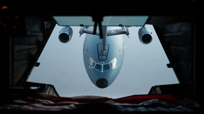 A U.S. Air Force KC-10 Extender connects to another KC-10 for aerial refueling over the U.S. Central Command area of responsibility, April 7, 2022. The KC-10 is an advanced tanker and cargo aircraft designed to provide increased global mobility for U.S. armed forces. (U.S. Air Force photo by Senior Airman Jacob B. Wrightsman)