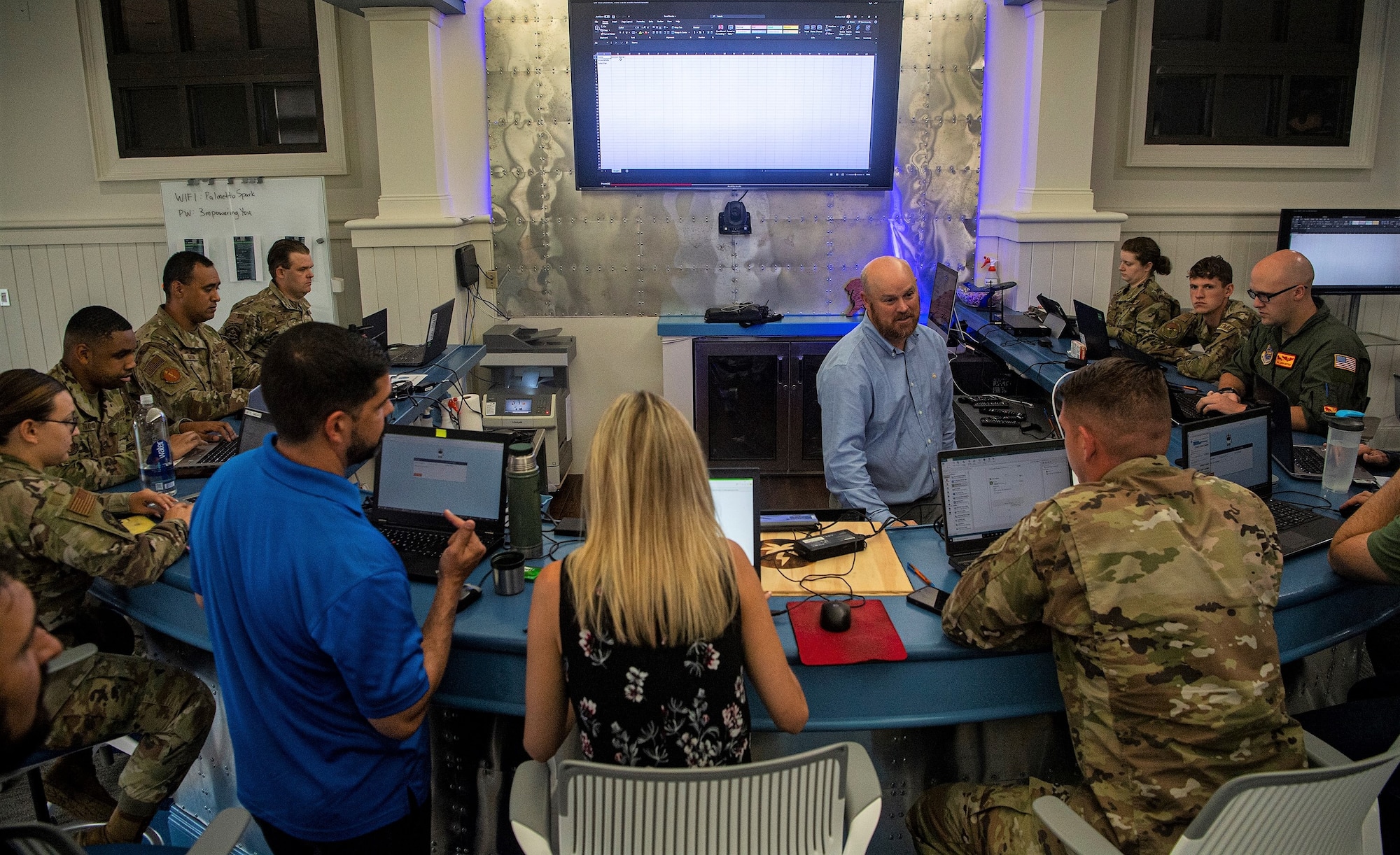 Air Force innovators meet for a brainstorming session in robotic process automation at Joint Base Charleston, S.C., in June 2021. The Air Force Research Laboratory is spearheading a pilot project, titled Innovative Pathway Initiative, designed to revamp and expedite the ideas of pioneering Airmen, Guardians, and civilians from start-to-finish. (U.S. Air Force photo/SSgt. Christian Sullivan)