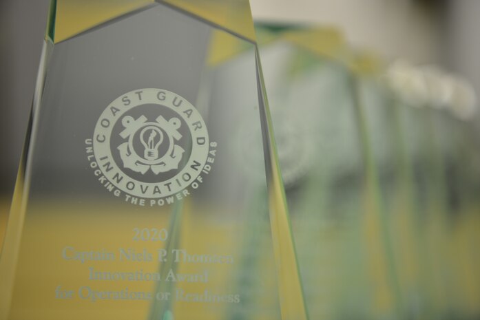 Innovation Award trophies lined up to be presented to the Niels Thomsen Innovation Award recipients during an award ceremony at Coast Guard Headquarters, March 2022. This year’s innovators found creative ways to solve and support members of the workforce.