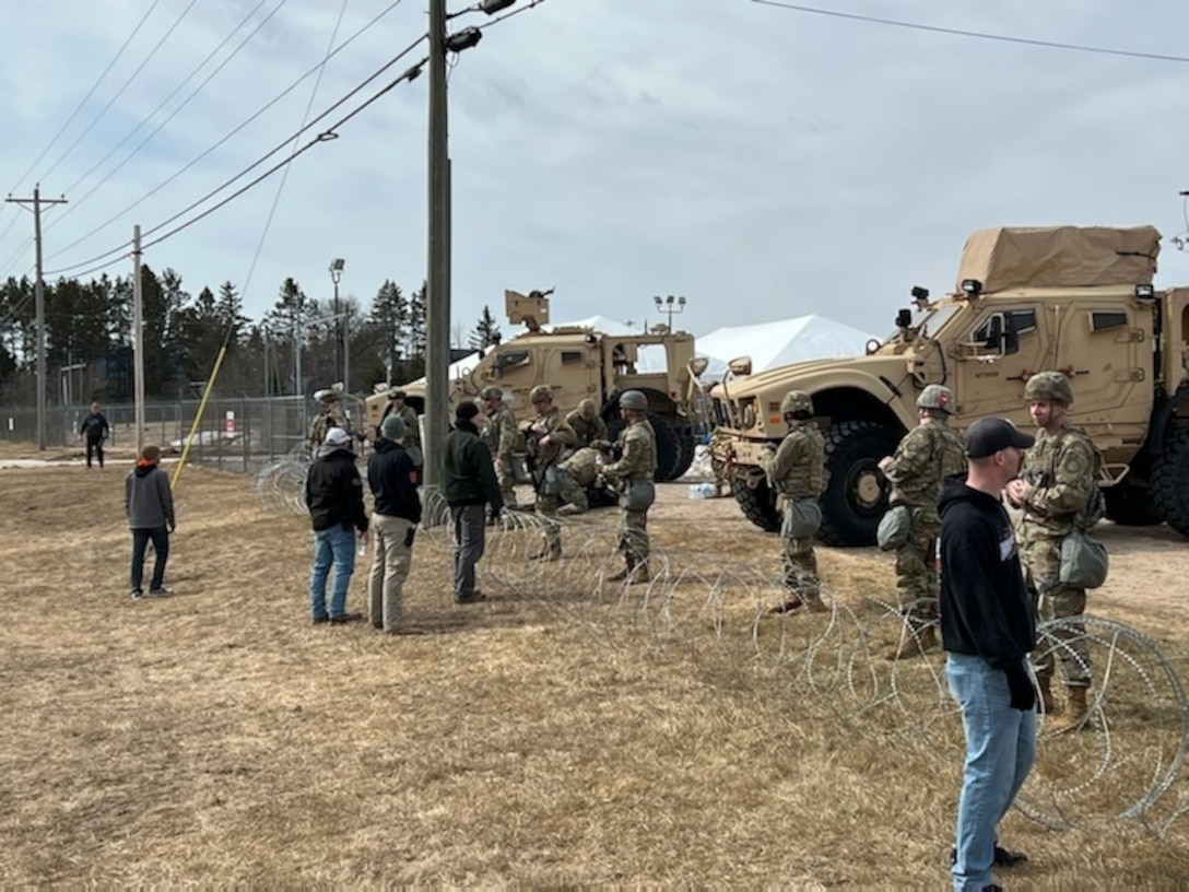 Michigan National Guard Soldiers conduct perimeter security during exercise Northern Exposure in the Upper Peninsula April 12, 2022. During the four-day training event, many of the events will be hosted by commercial and federal partners such as U.S. Forestry Service and U.S. Army Corps of Engineers. Northern Exposure is held annually in different Michigan counties.  Previous exercises have included floods, fires, civil disturbance, explosions and chemical spills. (Courtesy Photo).