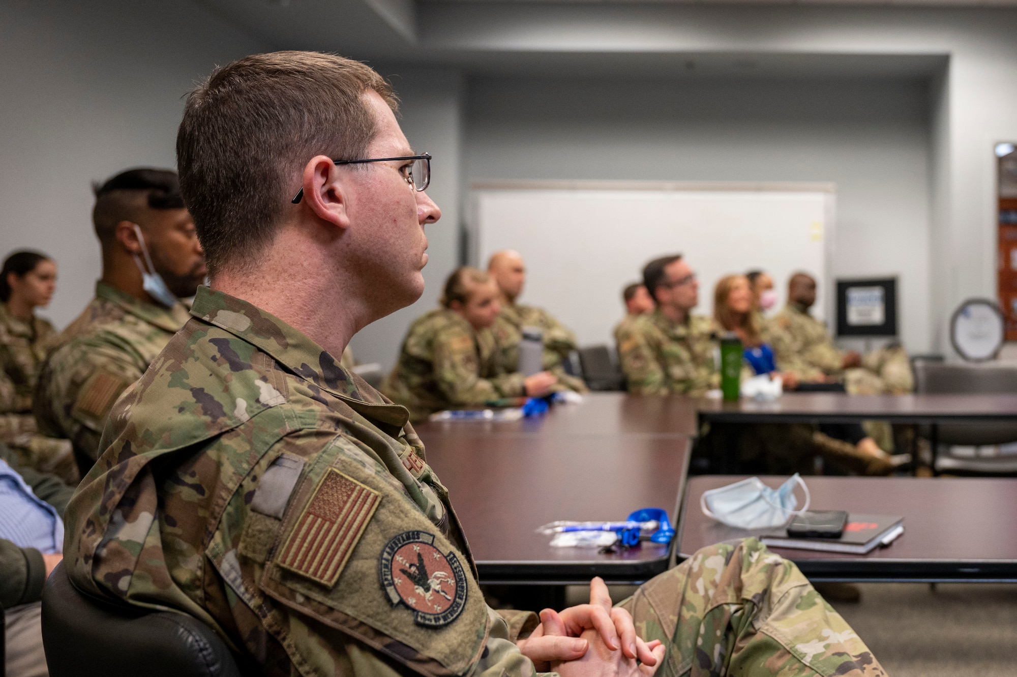 Airmen assigned to the 19th Medical Group attend a brief from the Air Force Wounded Warrior (AFW2) program