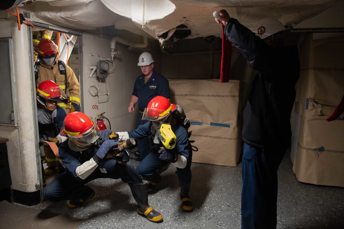 Sailors assigned to the aircraft carrier USS John C. Stennis (CVN 74) participate in a damage control drill aboard the ship in Newport News, Va.