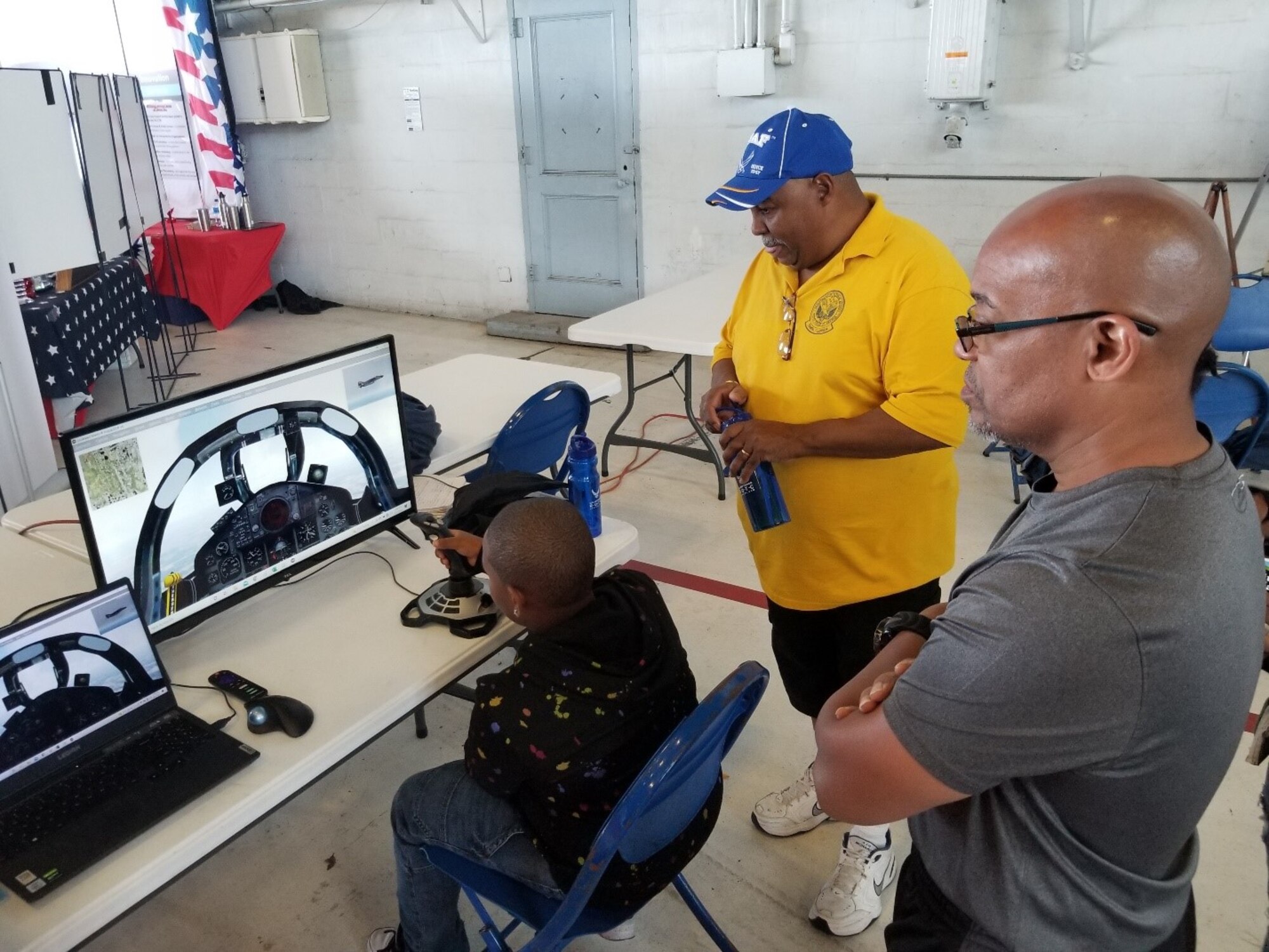 Behind the scenes, AirFest guests get to try their hand at an F-4 Phantom II fighter aircraft flight simulator during the 2022 Tampa Bay AirFest at MacDill Air Force Base, Florida, March 25-27. Nearly 185,000 guests gathered to commemorate the Air Force’s 75 years of global air superiority during the event, bolstering community support and inspiring past, present and future Airmen. (Courtesy photo)