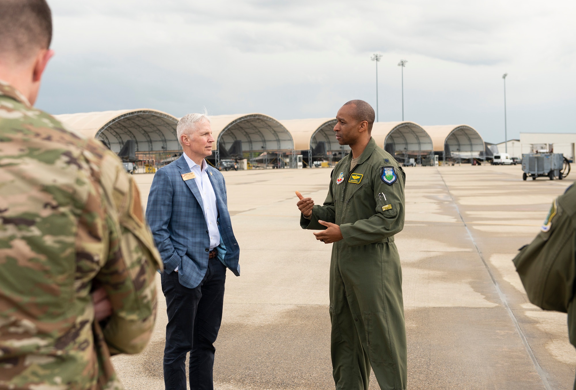 People talk on flightline.