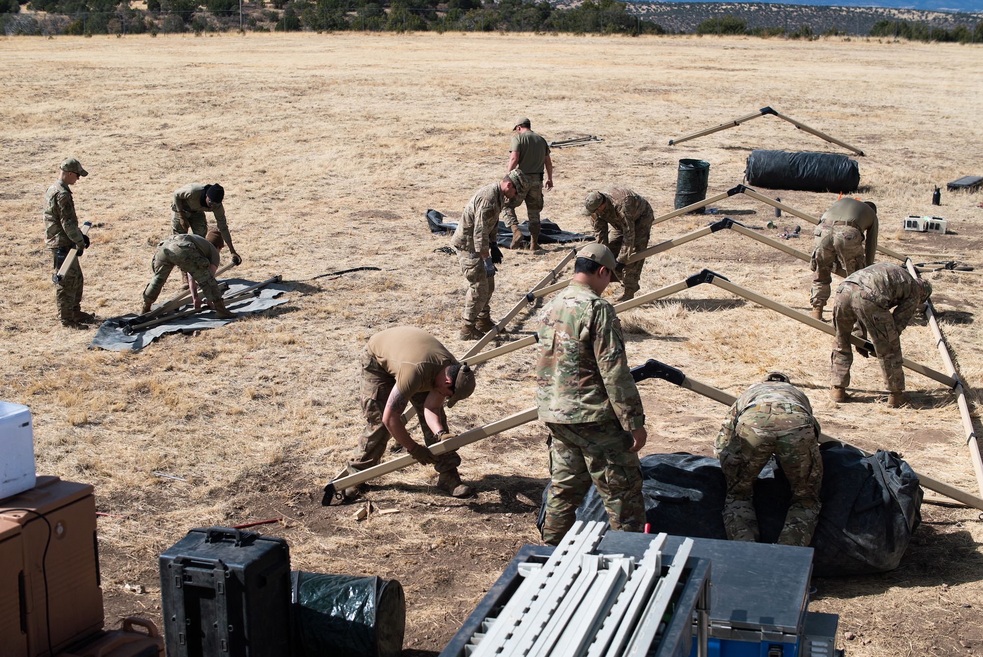 Air Commandos from the 27th Special Operations Mission Support Group, Detachment 1 Mission Sustainment Team 2 teardown a Utilis TM-54 tent during Full Mission Profile 22-3 exercise at Sierra Blanca Regional Airport. (U.S. Air Force photo by Senior Airman Christopher Storer)