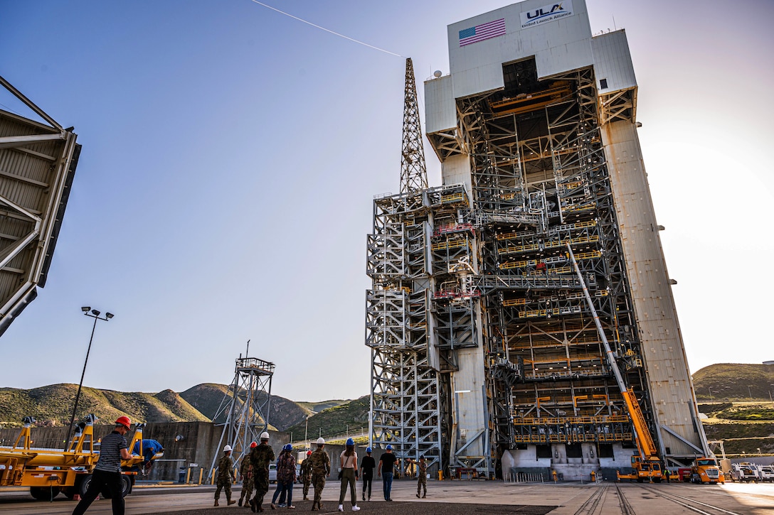 People walking towards launch tower