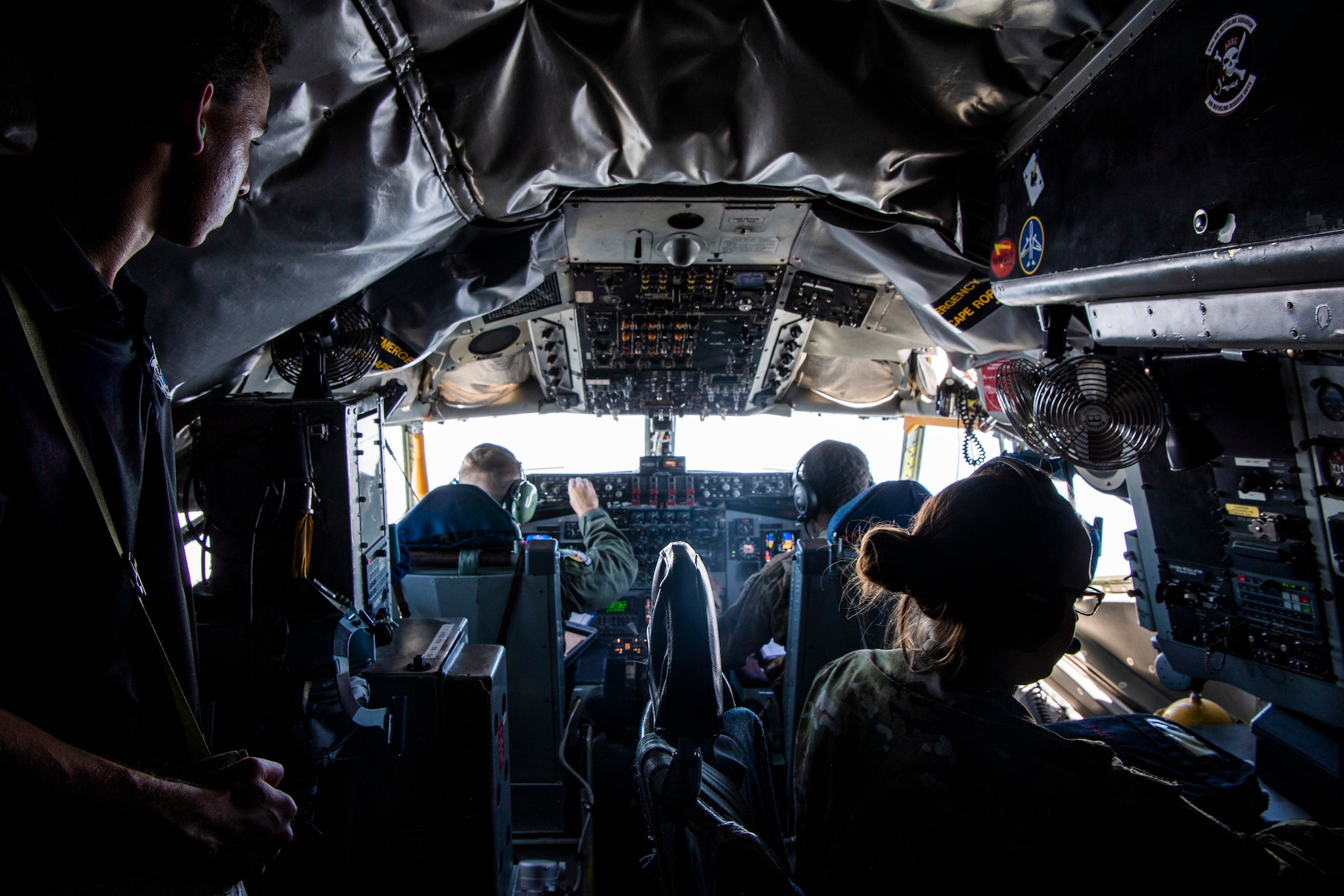 A cadet with Air Force ROTC Detachment 159 at the University of Central Florida observes Airmen from the 91st Air Refueling Squadron prepare a KC-135 Stratotanker for take-off at MacDill Air Force Base, Florida, April 11, 2022.