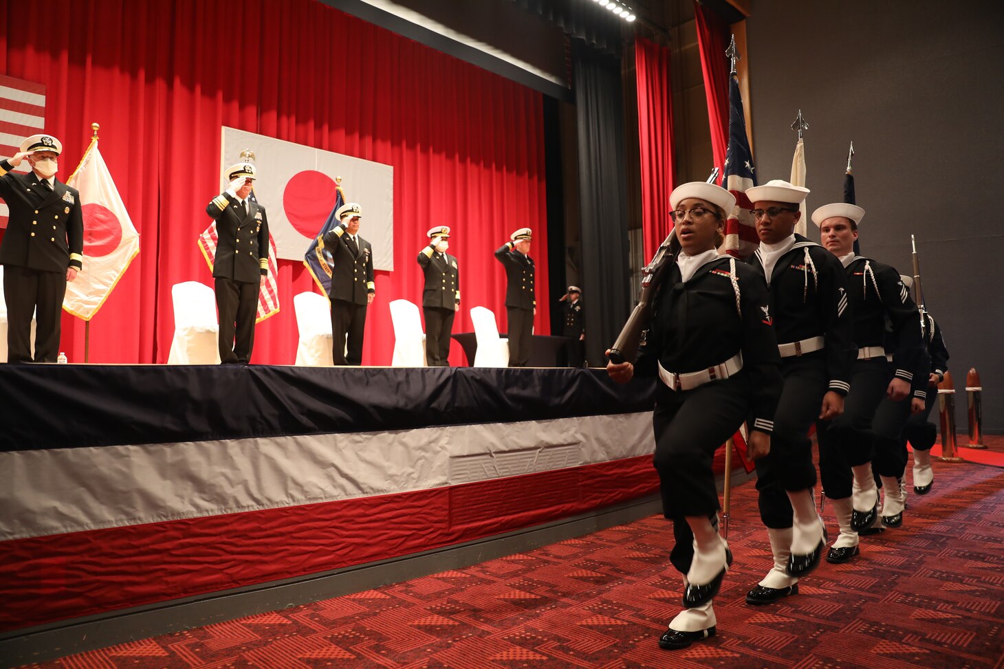 The U.S. Naval Hospital Yokosuka color guard parade the colors during the Submarine Group 7 change-of-command ceremony at Commander, Fleet Activities Yokosuka, Japan, on April 13, 2022. Submarine Group 7 directs forward-deployed, combat capable forces across the full spectrum of undersea warfare throughout the Western Pacific, Indian Ocean, and Arabian Sea.