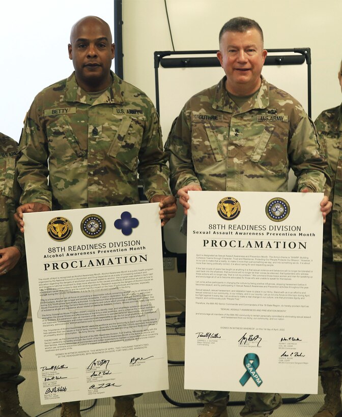 88th Readiness Division Commanding General, Maj. Gen. Darrell Guthrie, right, and 88th Readiness Division Command Sergeant Major, Command Sgt. Maj. Gregory O. Betty, left, display signed a Sexual Harassment/Assault Response and Prevention (SHARP) proclamation that reaffirms the U.S. Army Reserve's stance on SHARP at Fort Snelling, Minn., March 5, 2022. By signing the proclamation, Guthrie is committed to eliminating sexual assault, sexual harassment, and associated retaliation within the Army's ranks. SHARP programs educate service members on preventing assault, sexual harassment, and associated retaliation within the ranks. 
(U.S. Army Reserve Photo by Spc. Jauston Campbell)