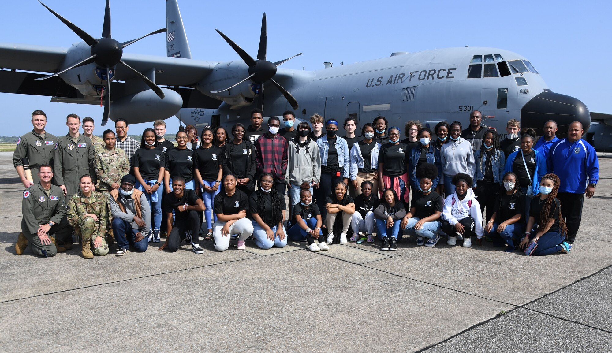 Keesler personnel and Jefferson Davis County High School Junior ROTC cadets pose for a photo in front of a WC-130J aircraft at Keesler Air Force Base, Mississippi, April 12, 2022. Throughout their visit to Keesler, more than 30 cadets received a Hurricane Hunters briefing, visited air traffic control training courses and received a military working dog demonstration. (U.S. Air Force photo by Kemberly Groue)