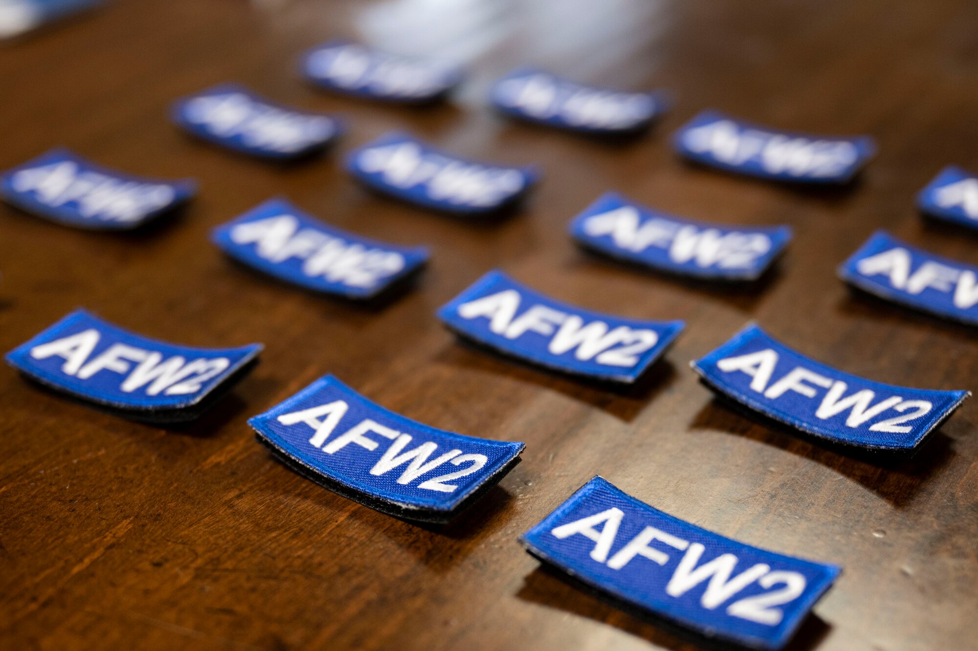 Patches provided by the Air Force Wounded Warrior (AFW2) program lay on a table during a brief
