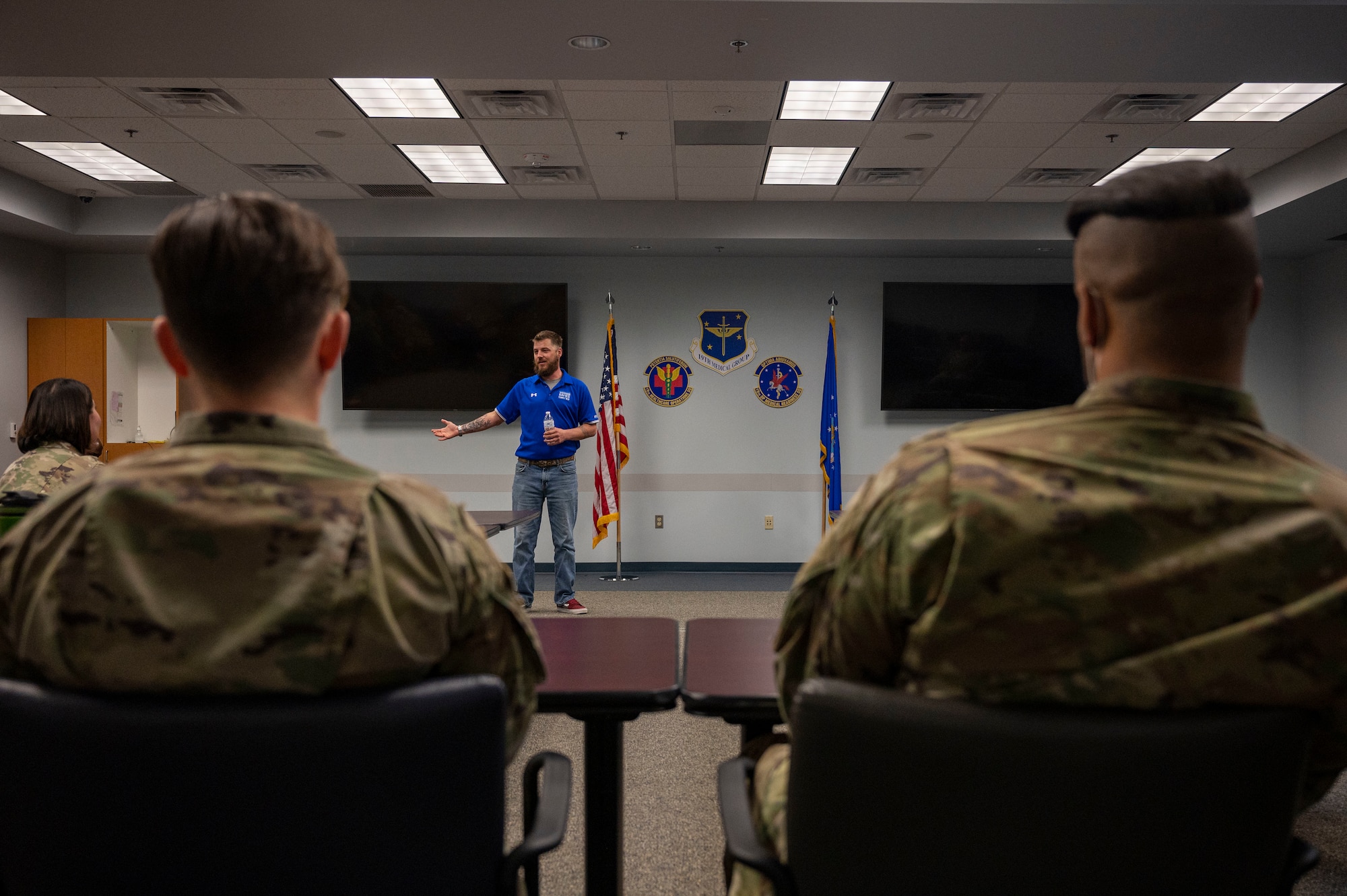 Retired Staff Sgt. Craig Taylor, Air Force Wounded Warrior (AFW2) program ambassador, gives a brief to Airmen assigned to the 19th Medical Group