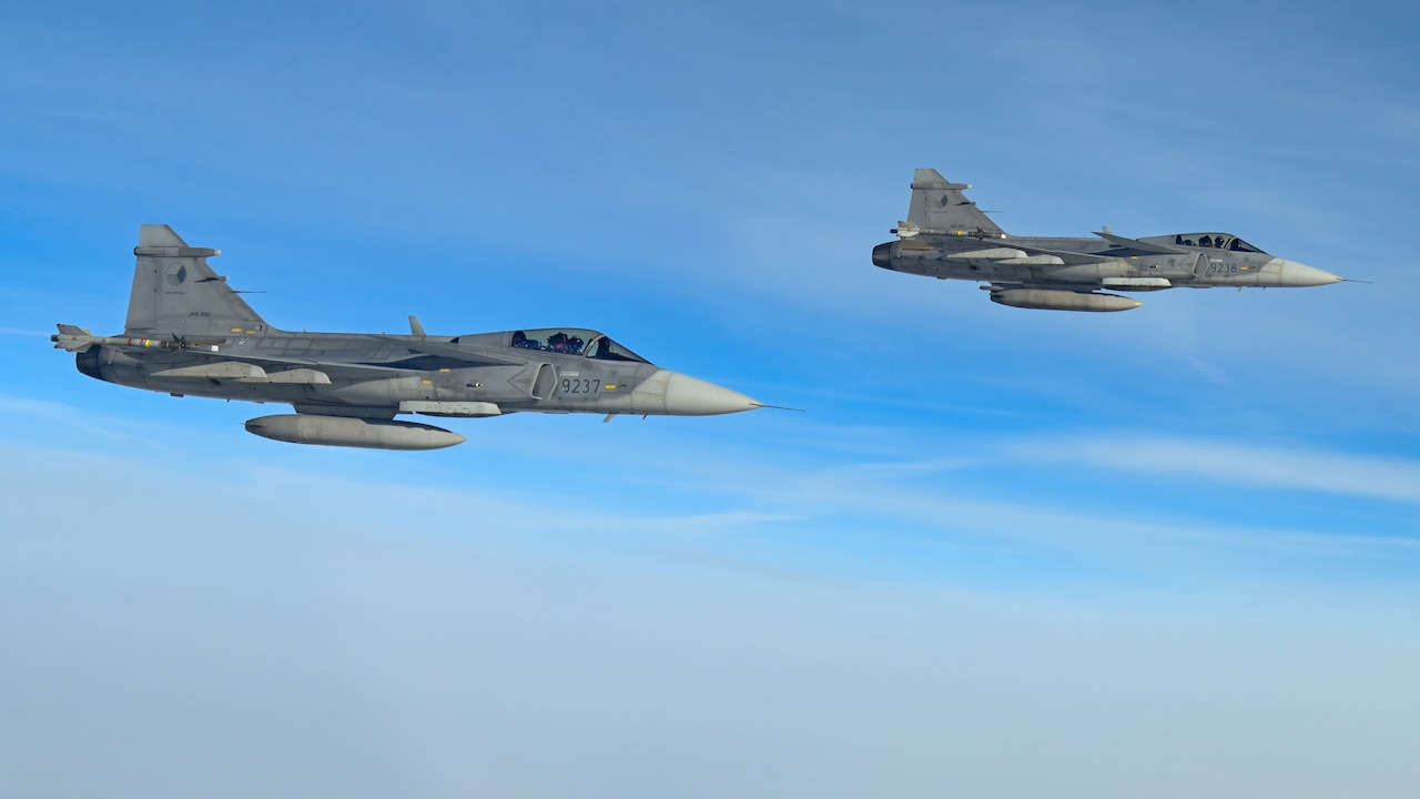 Two jets fly side by side