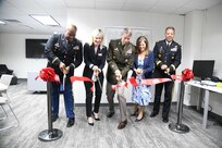 National Guard Bureau Chief Gen. Daniel Hokanson and his wife, Kelly, join DCNG adjutant general Brig. Gen. Aaron Dean, USO National Capital executive director Lisa Marie Riggins and DCNG Family Programs director Maj. Michael Robinson to cut the ribbon on the new USO lounge at the D.C. Armory April 12, 2022. (U.S. Air National Guard photo by Senior Master Sgt. Craig Clapper)