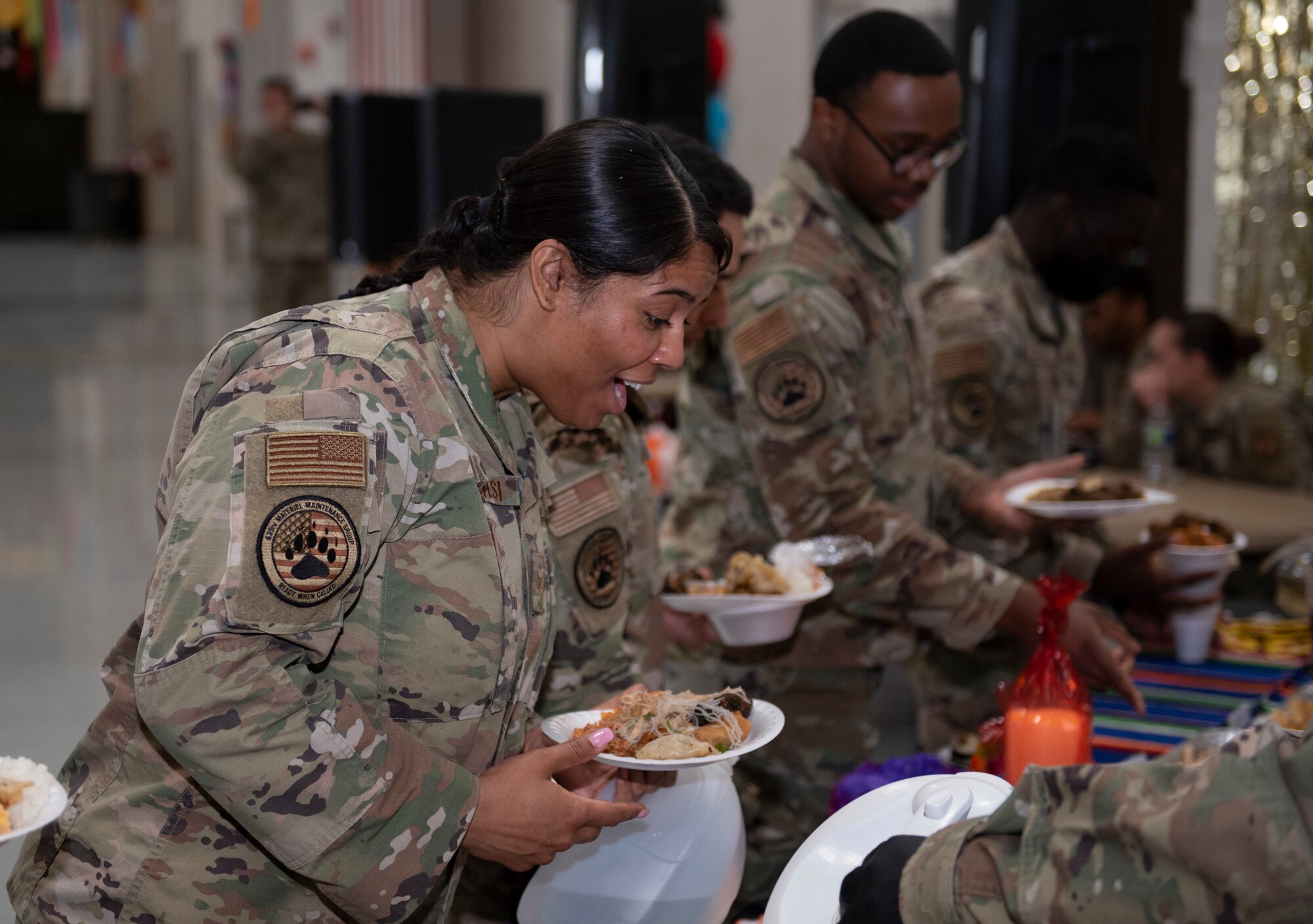 Staff Sgt. Aviana Genovesi, 635th Materiel Maintenance Squadron cargo movement supervisor, dishes a plate of food during Diversity Day at the Basic Expeditionary Airfield Resources Base April 8, 2022, on Holloman Air Force Base.