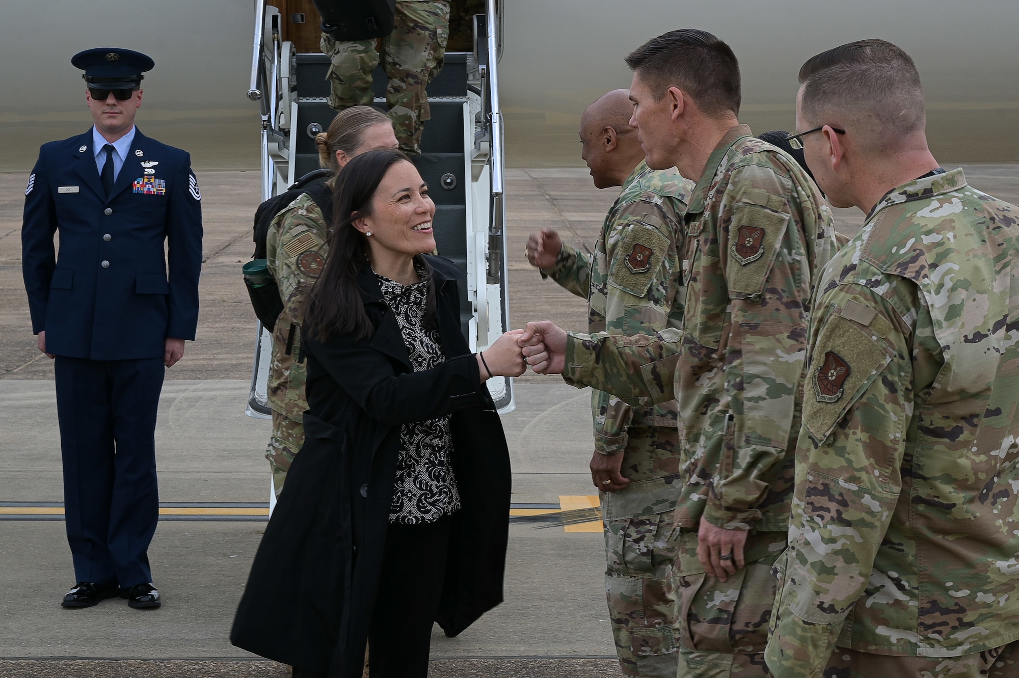 Leaders from Air Force Global Strike Command and 2nd Bomb Wing greet the Honorable Gina Ortiz Jones, Under Secretary of the Air Force, during her arrival to Barksdale Air Force Base, Louisiana, April 12, 2022. Jones visited Barksdale to attend the Women's Leadership Symposium and to see Barksdale’s Striker Nation culture and mission firsthand. (U.S. Air Force photo by Senior Airman Jonathan E. Ramos)