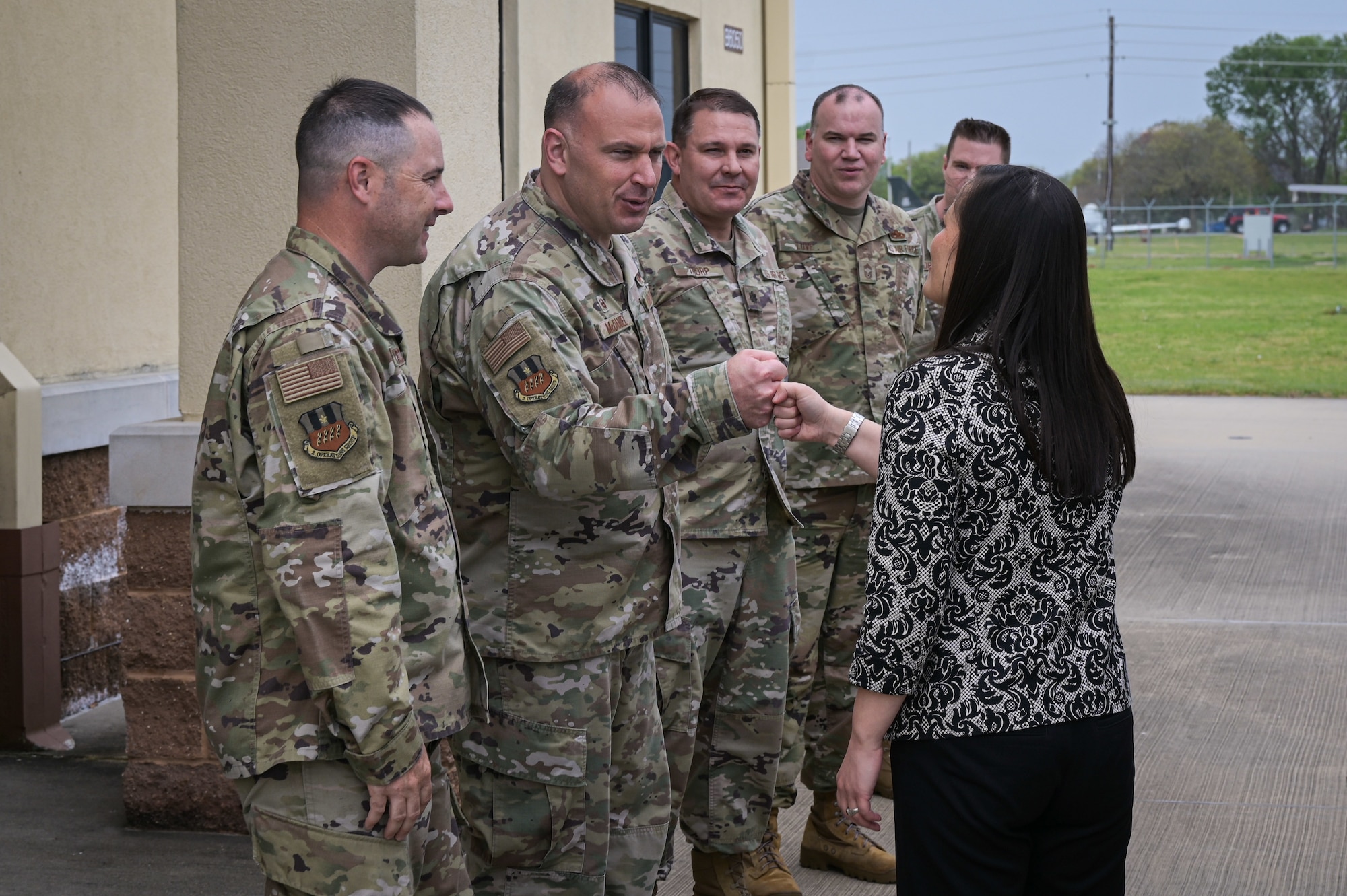 Leaders from 2nd Bomb Wing greet the Honorable Gina Ortiz Jones, Under Secretary of the Air Force, at the Tech Sgt. Joshua Kidd’s Weapons Load Training Facility during a visit to Barksdale Air Force Base, Louisiana, April 12, 2022. Tech Sgt. Joshua Kidd’s Weapons Load Training Facility was named after Tech. Kidd, a 2nd Maintenance Group, loading standardization crew chief who was shot and killed outside of his house in Bossier City, Louisiana. (U.S. Air Force photo by Senior Airman Jonathan E. Ramos)