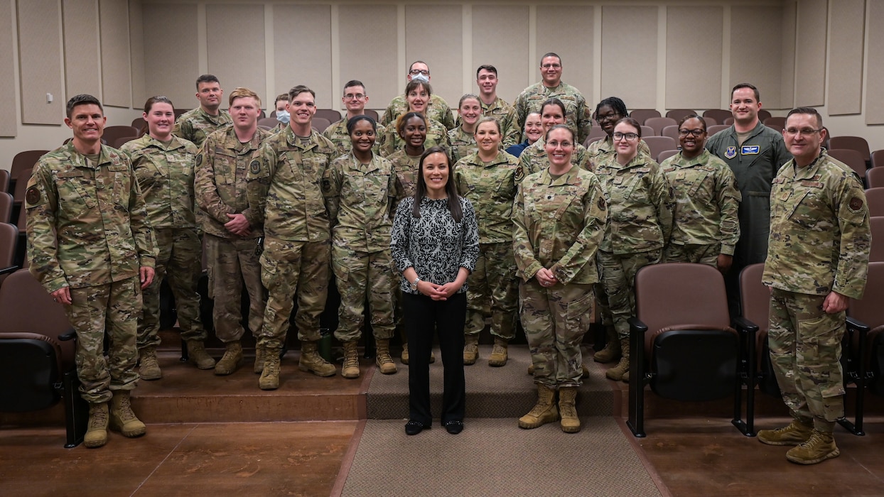 The Honorable Gina Ortiz Jones, Under Secretary of the Air Force, poses for a photo with leaders and Airmen from the 2nd Bomb Wing who innovatevely lead COVID-19 readiness efforts during a visit to Barksdale Air Force Base, Louisiana, April 12, 2022. Jones recognized Airmen who supported efforts during the COVID-19 pandemic. (U.S. Air Force photo by Senior Airman Jonathan E. Ramos)