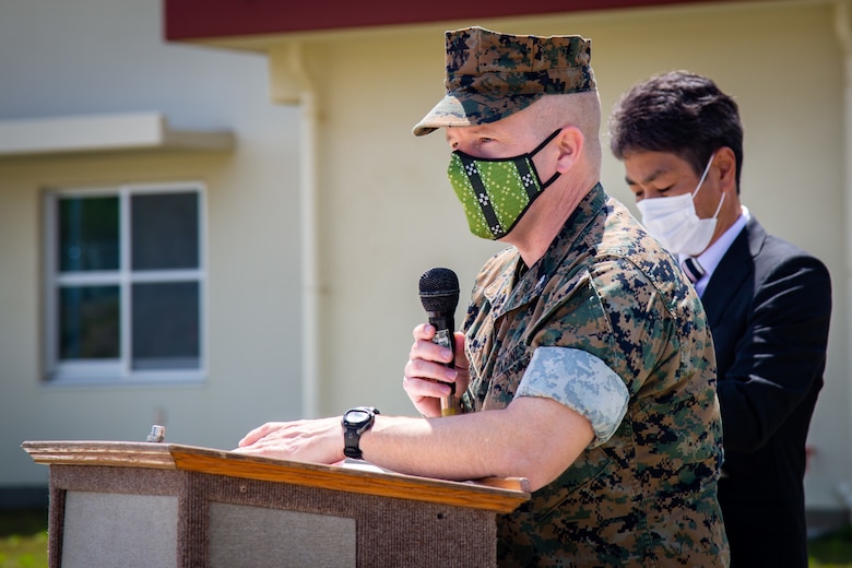 U.S. Marine Corps Col. Lester R. Gerber, commanding officer of III Marine Expeditionary Force Information Group, gives remarks during a ribbon-cutting for the Cook-Chill facility at Camp Hansen, Okinawa, Japan, on April 6, 2022. The ceremony recognized the movement from Camp Kinser to Camp Hansen and those who participated in the planning, execution, and construction process. It also showcased the importance of future developments of projects under the Defense Policy Review Initiative as part of the land redevelopment, including returns to the Government of Japan from the U.S. forces. (U.S. Marine Corps photo by Sgt. Kayla V. Staten)