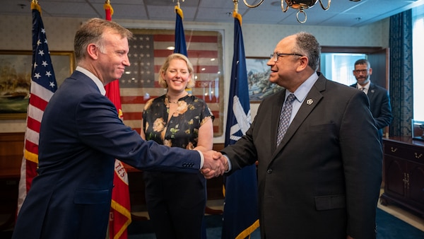The Honorable Erik K. Raven, left, is sworn in as the 34th Under Secretary of the Navy by Secretary of the Navy Carlos Del Toro April 13, 2022.