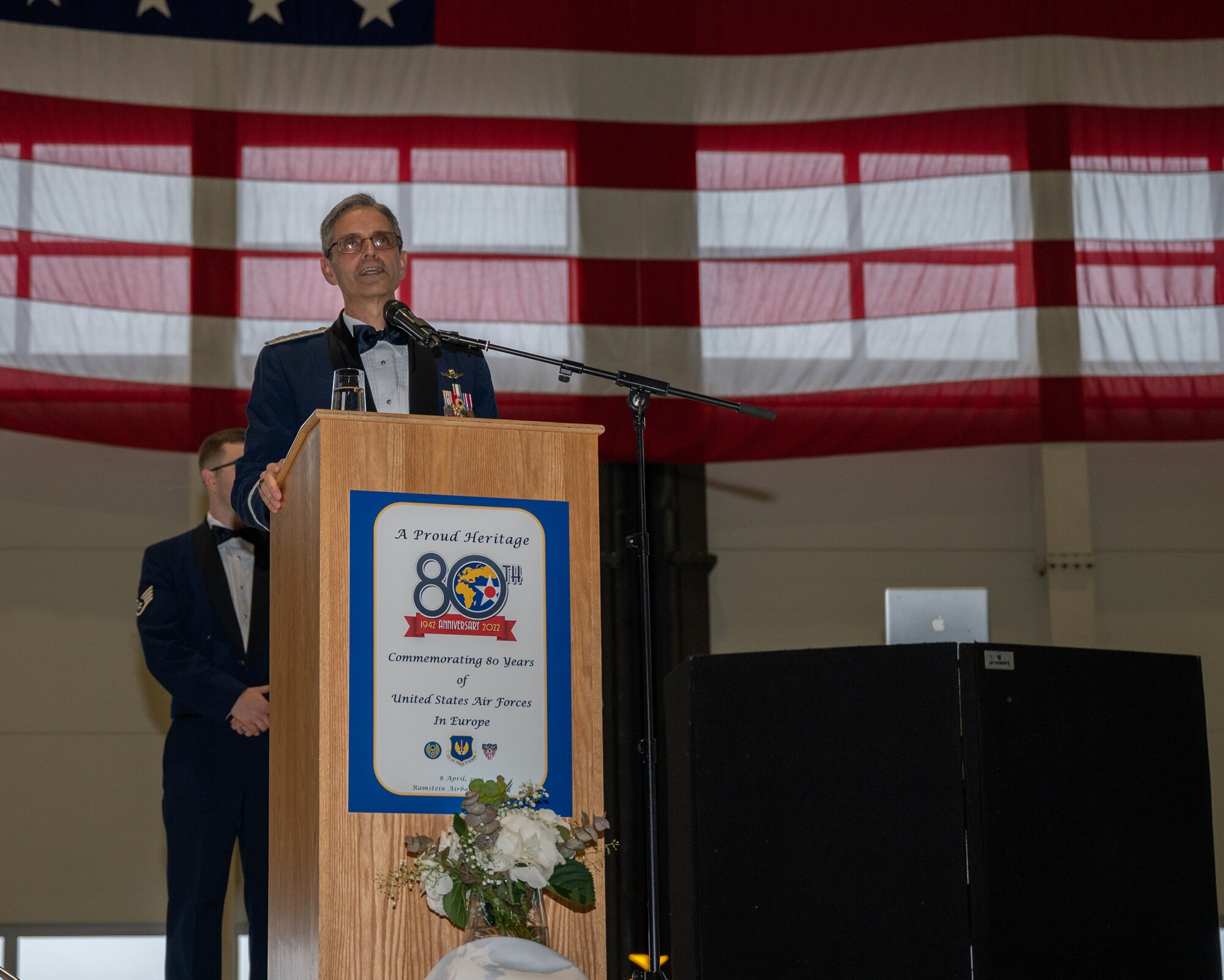An individual standing behind a podium.