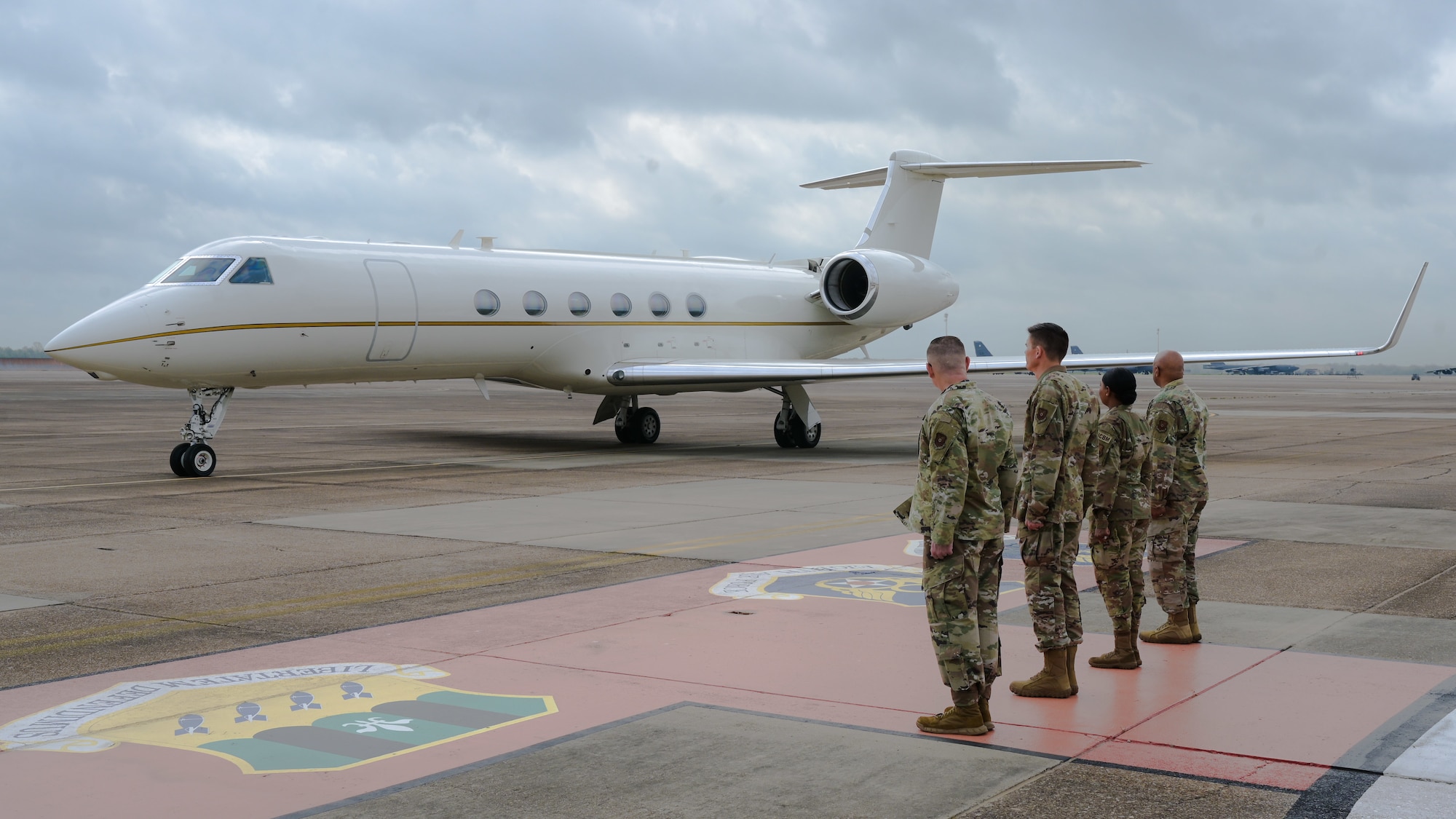 Leaders from Air Force Global Strike Command and 2nd Bomb Wing prepare to salute the Honorable Gina Ortiz Jones, Under Secretary of the Air Force, during her arrival at Barksdale Air Force Base, Louisiana, April 12, 2022. Jones visited Barksdale to attend the Women's Leadership Symposium and to see Barksdale’s Striker Nation culture and mission firsthand.. (U.S. Air Force photo by Senior Airman Jonathan E. Ramos)