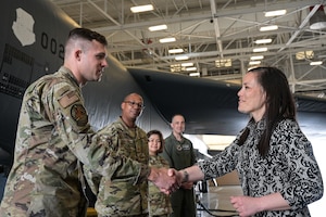 Leaders from Air Force Global Strike Command and 2nd Bomb Wing prepare to salute the Honorable Gina Ortiz Jones, Under Secretary of the Air Force, during her arrival at Barksdale Air Force Base, Louisiana, April 12, 2022. Jones visited Barksdale to attend the Women's Leadership Symposium and to see Barksdale’s Striker Nation culture and mission firsthand.. (U.S. Air Force photo by Senior Airman Jonathan E. Ramos)