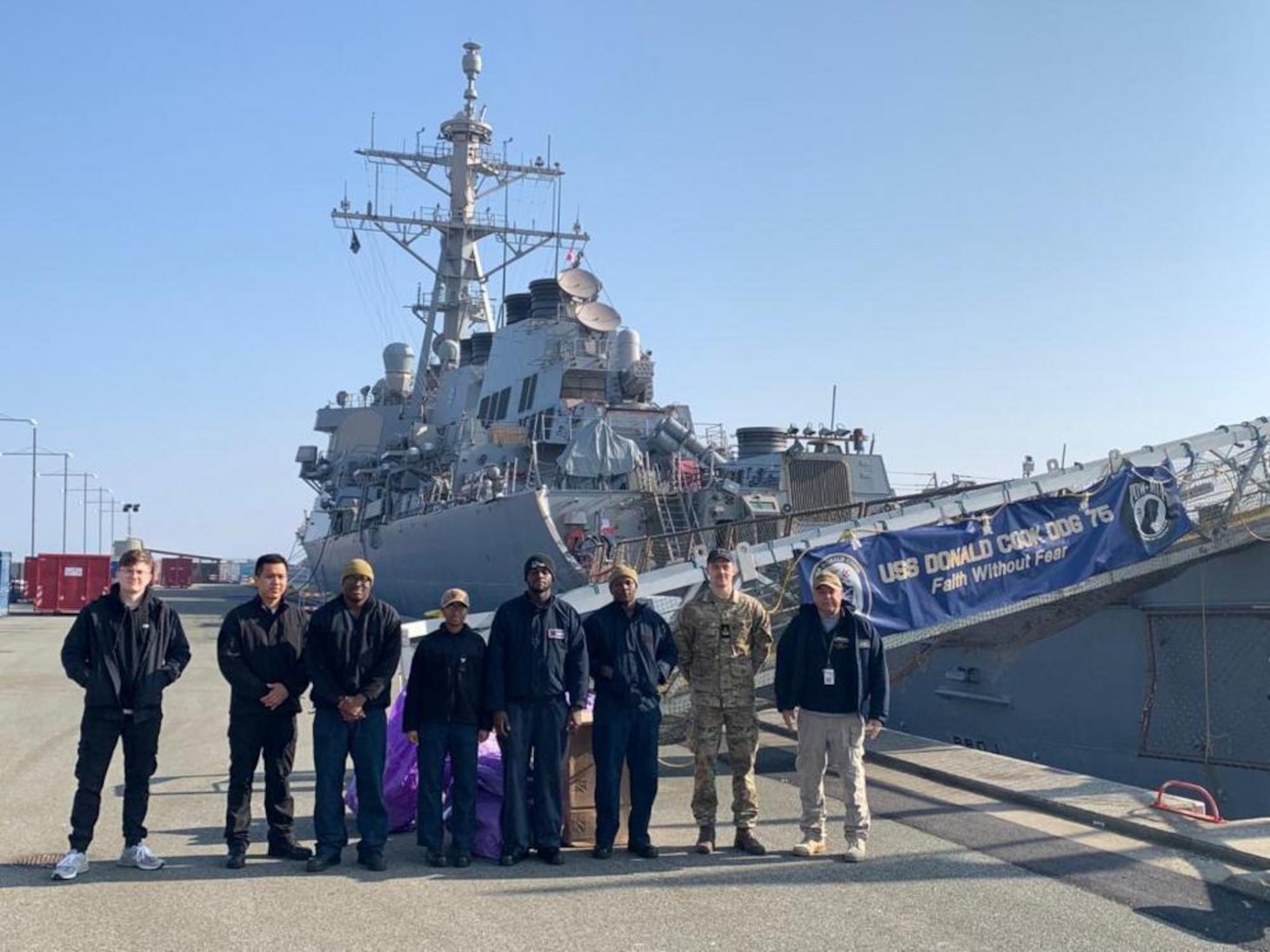 Logisticians assigned to Naval Supply Systems Command Fleet Logistics Center Sigonella and Danish sailors load USS Donald Cook March 21, 2022. Prior to pulling into port, The Sullivans and Donald Cook participated in NATO exercise Dynamic Guard Feb. 22-25 with Royal Danish Navy Iver Huitfeldt-class frigate HDMS Peter Willemoes (F362).