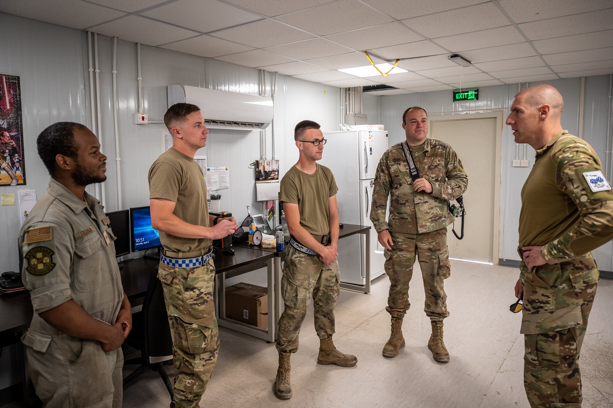Chief Master Sgt. Sean Milligan, 332nd Air Expeditionary Wing command chief, speaks with members of the 55th Expeditionary Fighter Generation Squadron, during a shift change at an undisclosed location in Southwest Asia, April 9, 2022. These immersion visits provide greater insight into every Airman's unique skillsets to the 332d AEW Red Tail team. (U.S. Air Force photo by Christopher Parr)