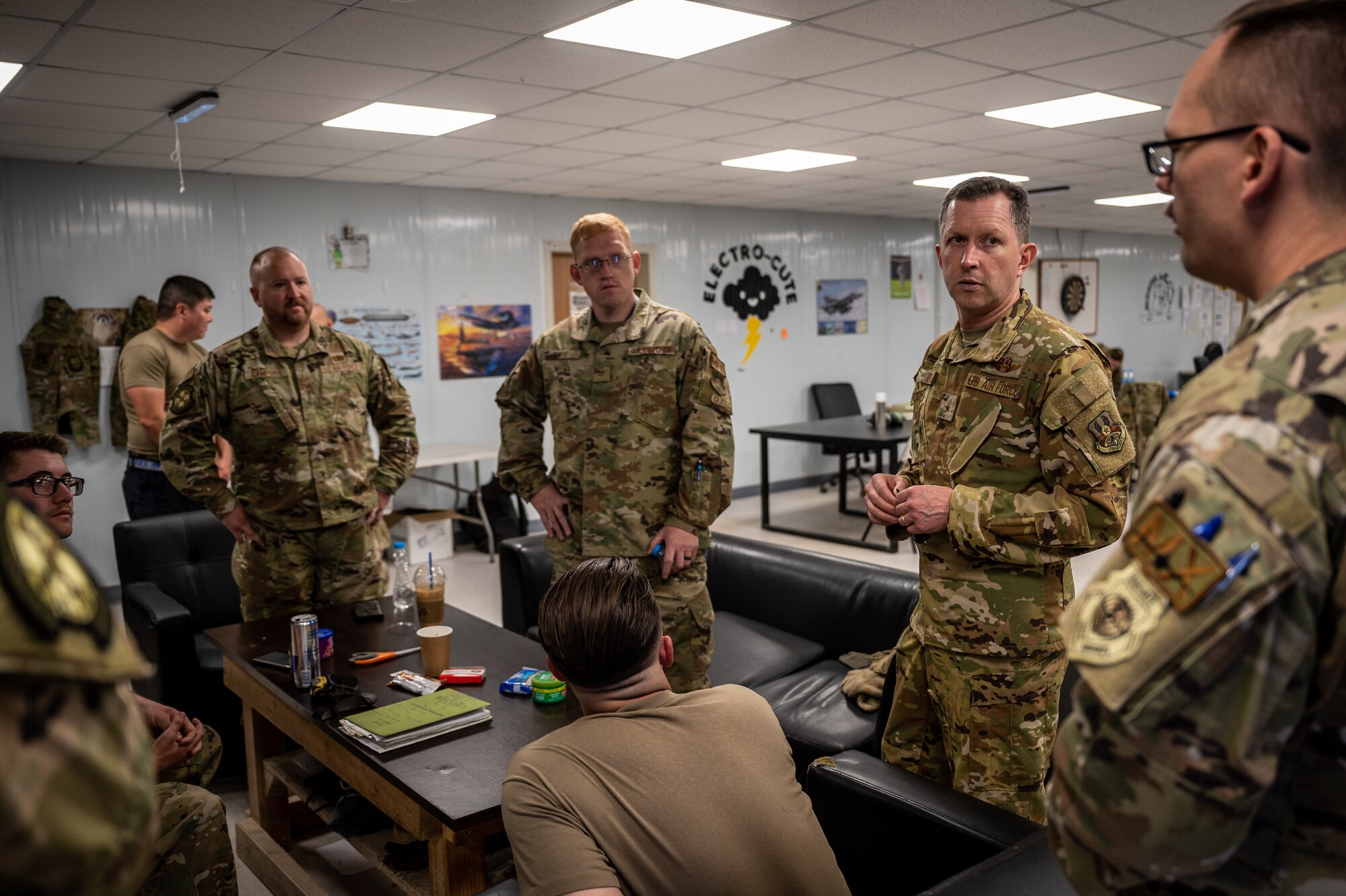 Brig. Gen. Christopher Sage, 332d Air Expeditionary Wing commander, speaks with 55th Expeditionary Fighter Generation Squadron Airmen during a shift change at an undisclosed location in Southwest Asia, April 9, 2022. These immersion visits provide greater insight into every Airman's unique skillsets to the 332d AEW Red Tail team. (U.S. Air Force photo by Christopher Parr)