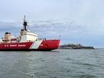 The U.S. Coast Guard Cutter Polar Star passes Alcatraz as the cutter transits the San Francisco Bay, April 4, 2022. Following their 147-day Antarctic deployment, the cutter will undergo annual maintenance in a Vallejo, California, dry dock. Courtesy photo by Sachiko Itagaki.