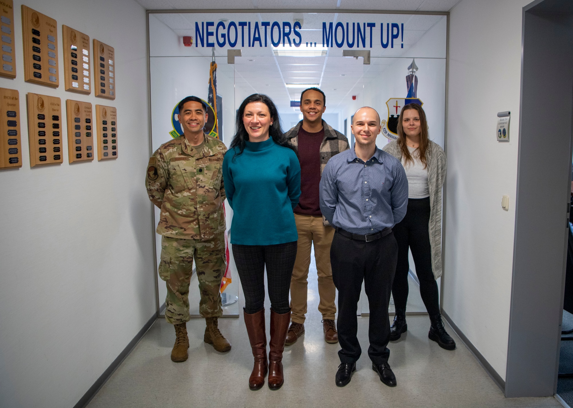 Members from the 52nd Contracting Squadron pose for a photo, April 7, 2022, on Spangdahlem Air Base, Germany. The 52nd CONS established long-term contract options affording the 52nd Fighter Wing the capability to support current and future mission growth. (U.S. Air Force photo by Airman 1st Class Jessica Sanchez-Chen)