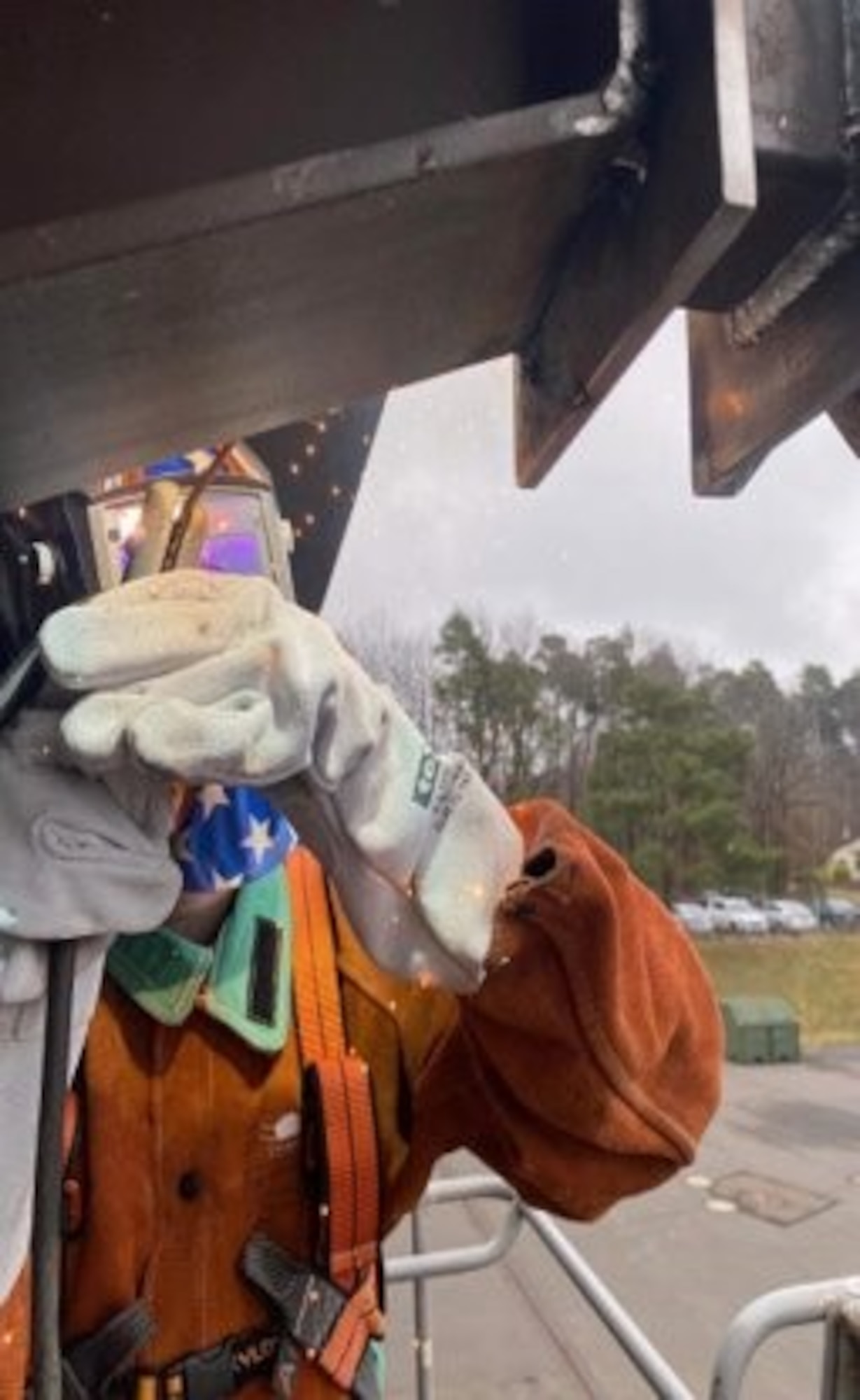 An Airman from the 52nd Civil Engineering Squadron welds an antenna on a dorm building, on Spangdahlem Air Base, Germany. The 52nd CES supported the arrival of Airmen from Fairchild Air Force Base, Washington, and Hill AFB, Utah, by making sure their lodging was in livable conditions. (Courtesy photo)