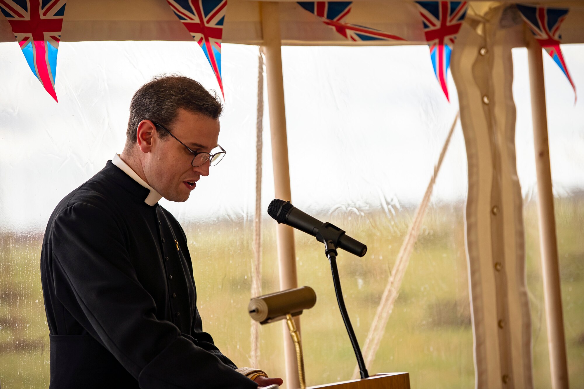 Father Oliver Coss, Rector of All Saints’ Church, Northampton, gives the invocation during the Queen’s Green Canopy event at RAF Croughton, England, April 13, 2022. The event celebrated the Queen’s Platinum Jubilee initiative, marking the 70th year of her reign. During the event, trees were planted to create a legacy in honor of the queen’s leadership of the nation. (U.S. Air Force photo by Staff Sgt. Eugene Oliver)