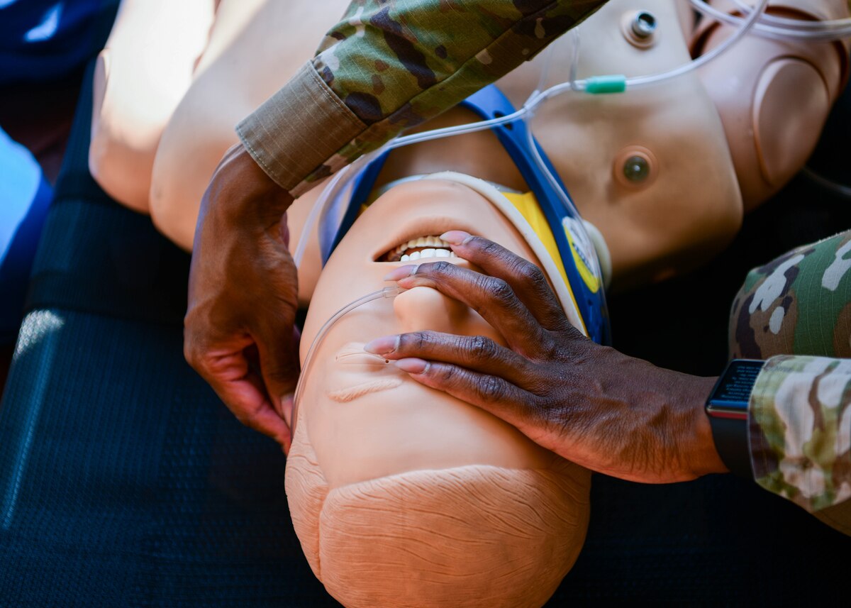 U.S. Air Force Capt. Janaye Greene, 31st Healthcare Operations Squadron lead clinical nurse, inserts a nasal cannula into a medical mannequin’s nose during a ‘trauma care under fire’ training at Aviano Air Base, Italy, April 12, 2022. The training simulated an individual with head trauma and seizures. The team treated the patient using a 9-line method and called in a medevac. During this process, the team gave a representative a standardized 9-point description of what's going on. (U.S. Air Force photo by Senior Airman Brooke Moeder)