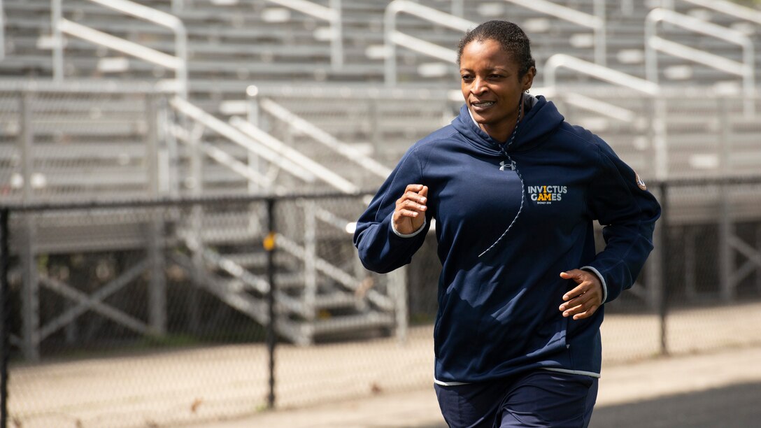 An RSM jogs during warmups for track practice.