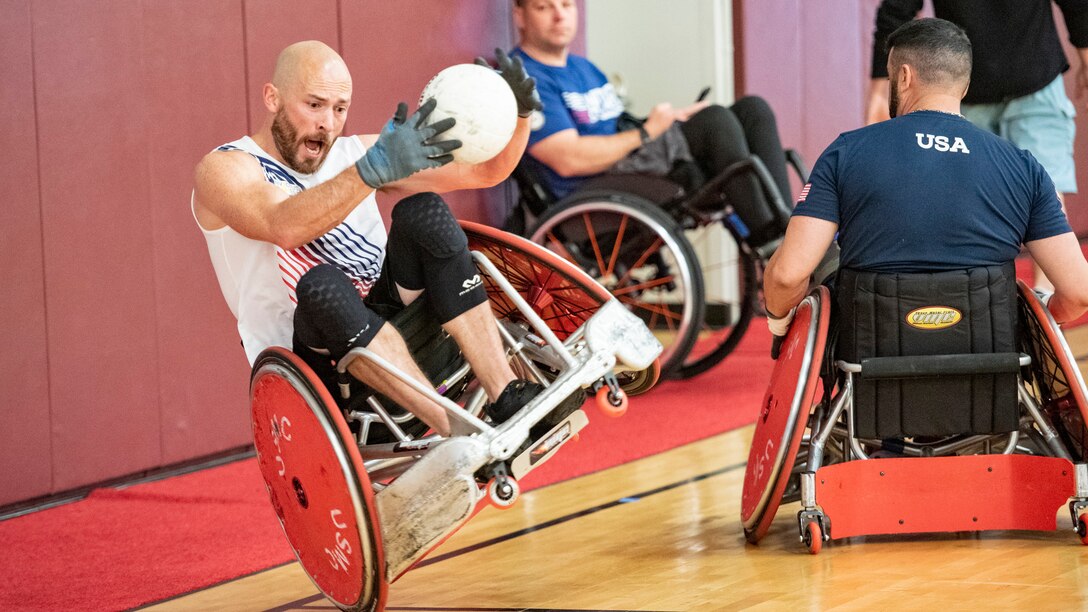 An RSM falls during a wheelchair rugby game.
