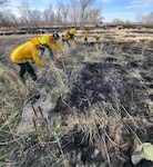 Airmen from the Nebraska Air National Guard's 155th Air Refueling Wing fire department establish a fire break to prevent wildfire spread near Arapahoe, Neb., April 11, 2022. High wind and drought fueled a fire that burned more than 30,000 acres and destroyed or damaged dozens of homes and other structures in Gosper and Furnas counties in south central Nebraska.