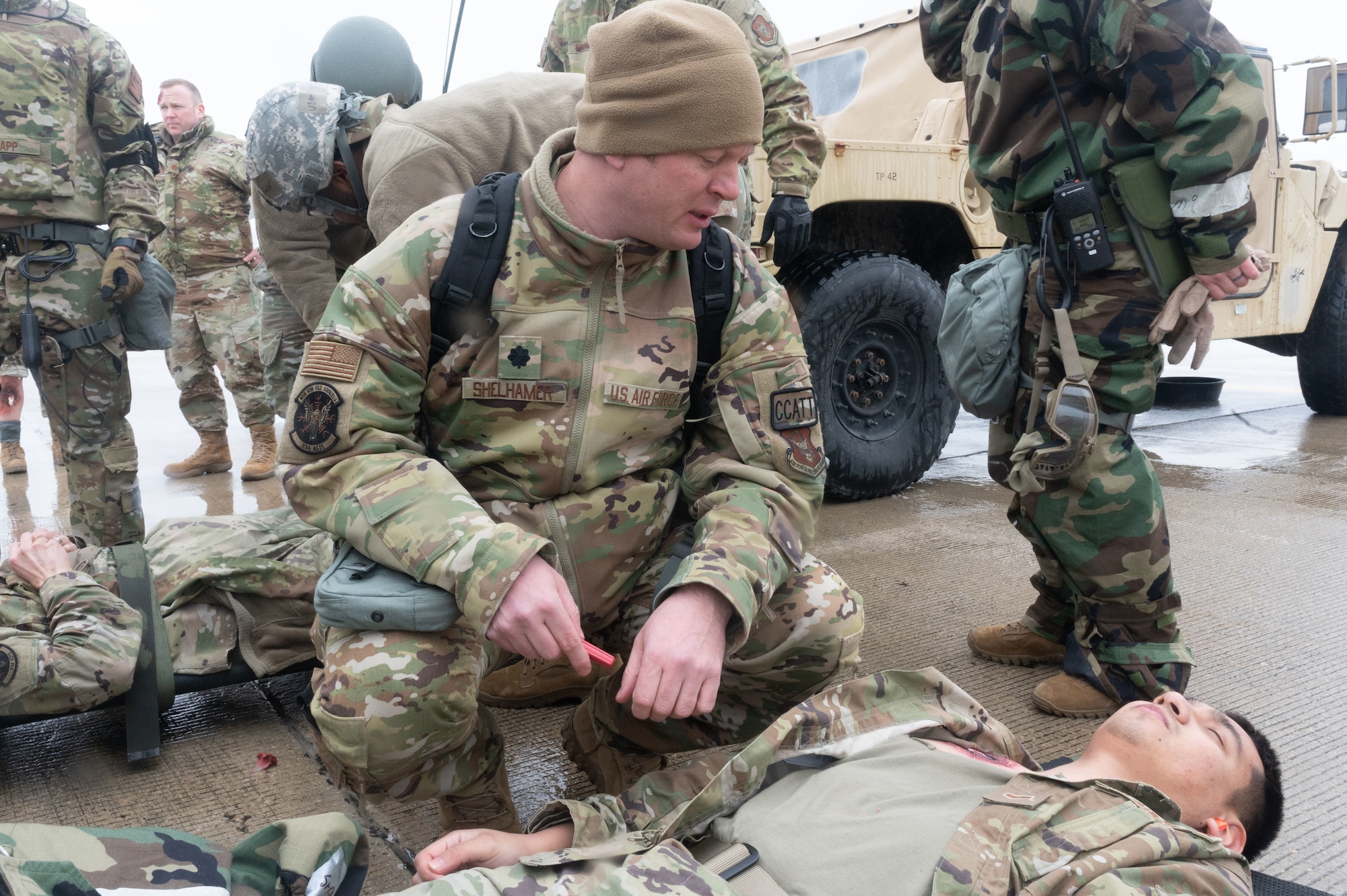 Lt. Col. Mehdi Shelhamer, a 934th Critical Care Air Transportation Team physician, examines patient during exercise viking sheild, at the Volk Field Air National Guard Base, Wisconsin, April 7, 2022. Viking Shield is a 934th Airlift Wing led exercise designed to strengthen training in a degraded environment..(U.S. Air Force photo by Airman 1st Class Colten Tessness)