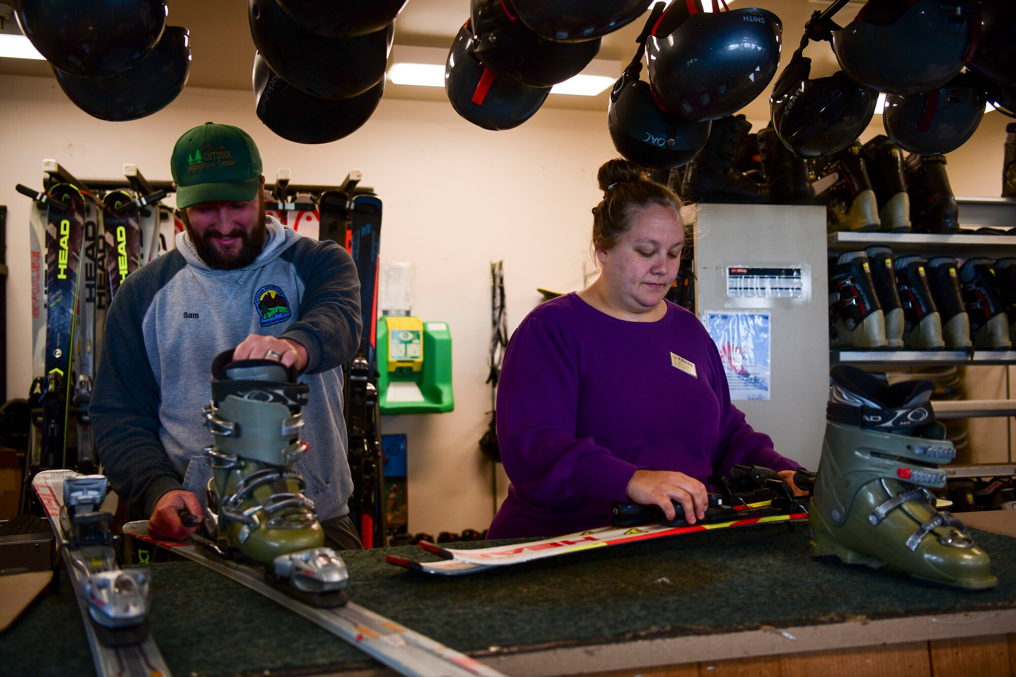 Samuel Carroll, 9th Force Support Squadron outdoor programmer and Ashlie Giesick, 9th Force Support Squadron recreation assistant work together on ski rentals at the outdoor recreation center at Beale Air Force Base