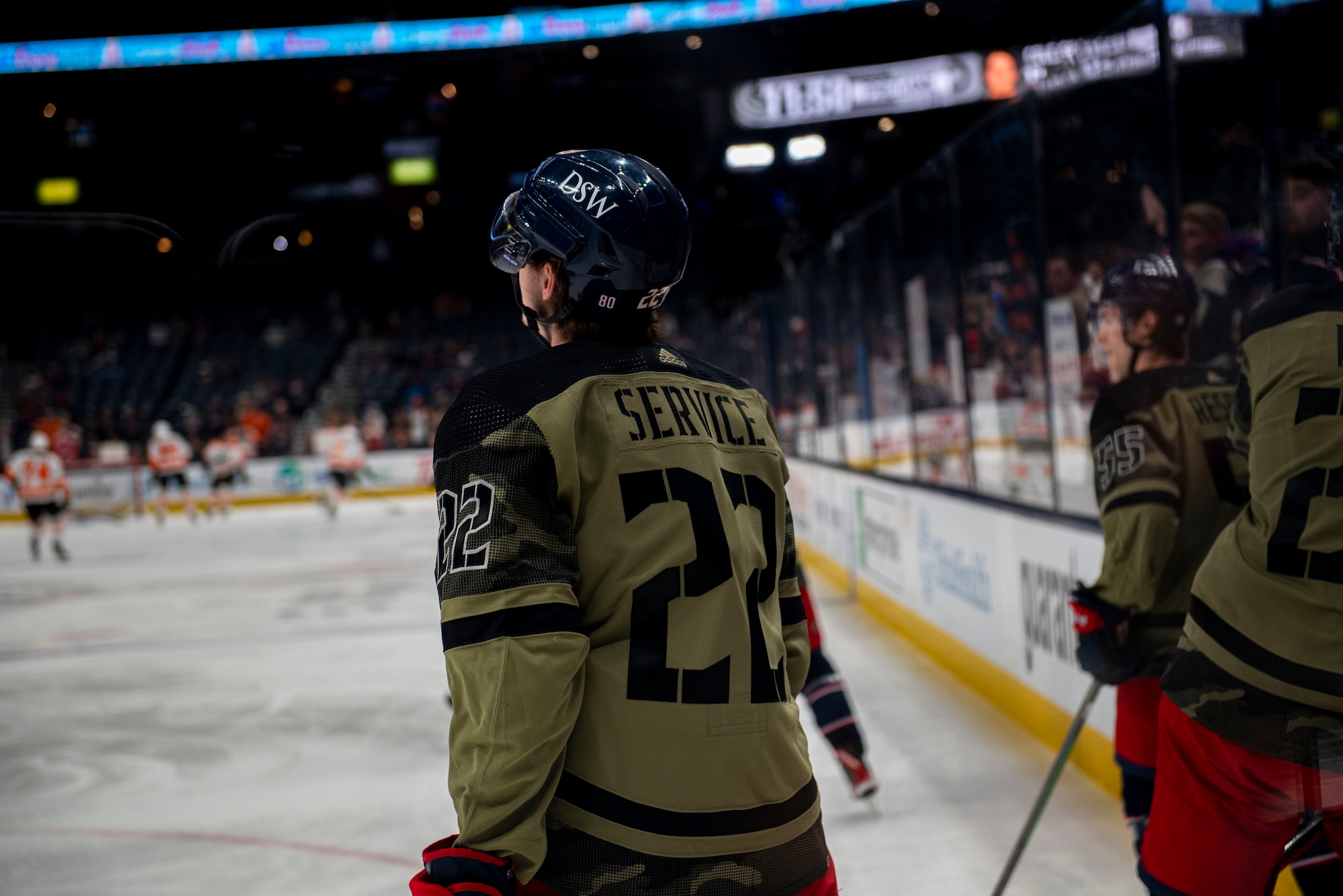 Jake Bean (22), a Columbus Blue Jackets defenseman, warms up in a camouflage-style uniform as part of Military Appreciation Night on April 7, 2022, at Nationwide Arena, Columbus, Ohio. Prior to facing the Philadelphia Flyers, the team hosted a friendly alumni exhibition with the Wright Flyers, as well as several other recognition activities throughout the night. (U.S. Air Force photo by Senior Airman Jack Gardner)