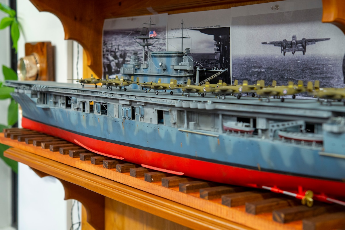 A 4.5-foot model of the aircraft carrier USS Hornet sits on display in Building 15 on April 6, 2022, at Wright-Patterson Air Force Base. David Frank, the 788th Civil Engineer Squadron’s Emergency Management chief, built a collection of models for the 80th anniversary of the Doolittle Raid, in which 16 B-25s took off from the USS Hornet and performed bombing strikes on Tokyo during World War II. (U.S. Air Force photo by Senior Airman Jack Gardner)