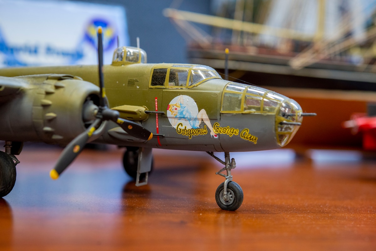 The model of a B-25 bomber is on display in Building 15on April 6, 2022, at Wright-Patterson Air Force Base. David Frank, the 788th Civil Engineer Squadron’s Emergency Management chief, built a collection of models for the 80th anniversary of the Doolittle Raid, in which 16 B-25s took off from the USS Hornet and performed bombing strikes on Tokyo during World War II.. (U.S. Air Force photo by Senior Airman Jack Gardner)
