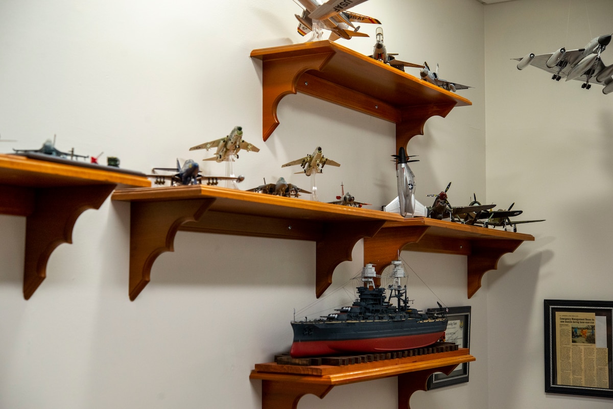 A collection of models built by David Frank, the 788th Civil Engineer Squadron’s Emergency Management chief, sit on display April 6, 2022, in Building 15 at Wright-Patterson Air Force Base. He put together a new set for the 80th anniversary of the Doolittle Raid, in which 16 B-25s took off from the USS Hornet on April 18, 1942, and performed bombing strikes on Tokyo during World War II. (U.S. Air Force photo by Senior Airman Jack Gardner)