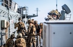 Force Reconnaissance Marine with Command Element, 31st Marine Expeditionary Unit, sets security perimeter on starboard bridge wing during visit, board, search, and seizure exercise aboard amphibious dock landing ship USS Germantown, South China Sea, September 6, 2020 (U.S. Navy/Taylor DiMartino)