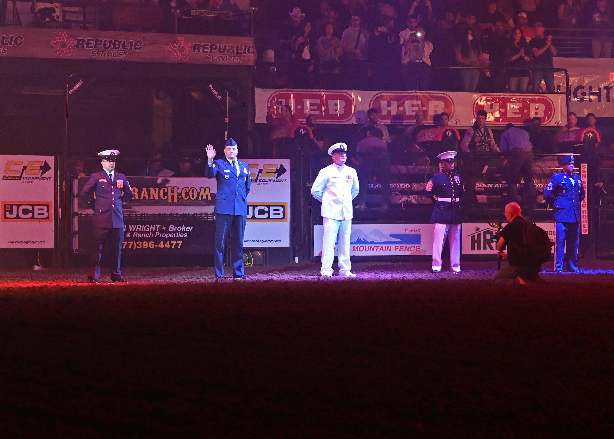 Event attendees recognize military members during the San Angelo Stock Show and Rodeo at the Foster Communications Coliseum, April 13, 2022. The San Angelo Stock Show and Rodeo Association hosted Military Appreciation Night to thank service members for the country's defense. (U.S. Air Force photo by Airman 1st Class Sarah Williams)