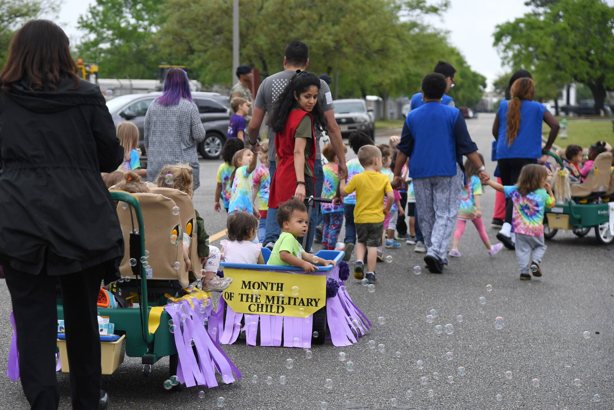 Children from the Keesler Child Development Center participate in a parade at Keesler Air Force Base, Mississippi, April 14, 2022. The parade was held in recognition for the Month of the Military Child, which is celebrated throughout the month of April. (U.S. Air Force photo by Kemberly Groue)