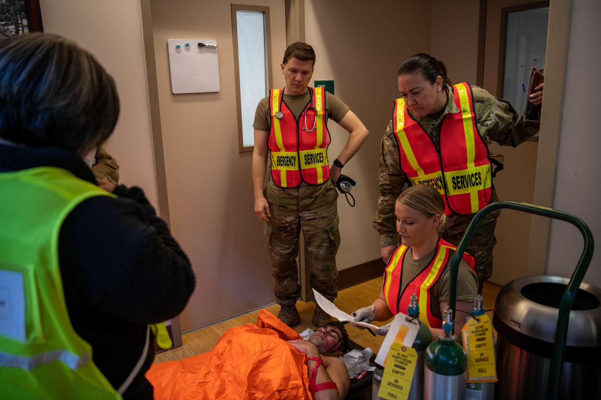 Airmen from the 22nd Medical Group perform secondary care on a simulated casualty during Exercise Ready Eagle April 8, 2022, at McConnell Air Force Base, Kansas.