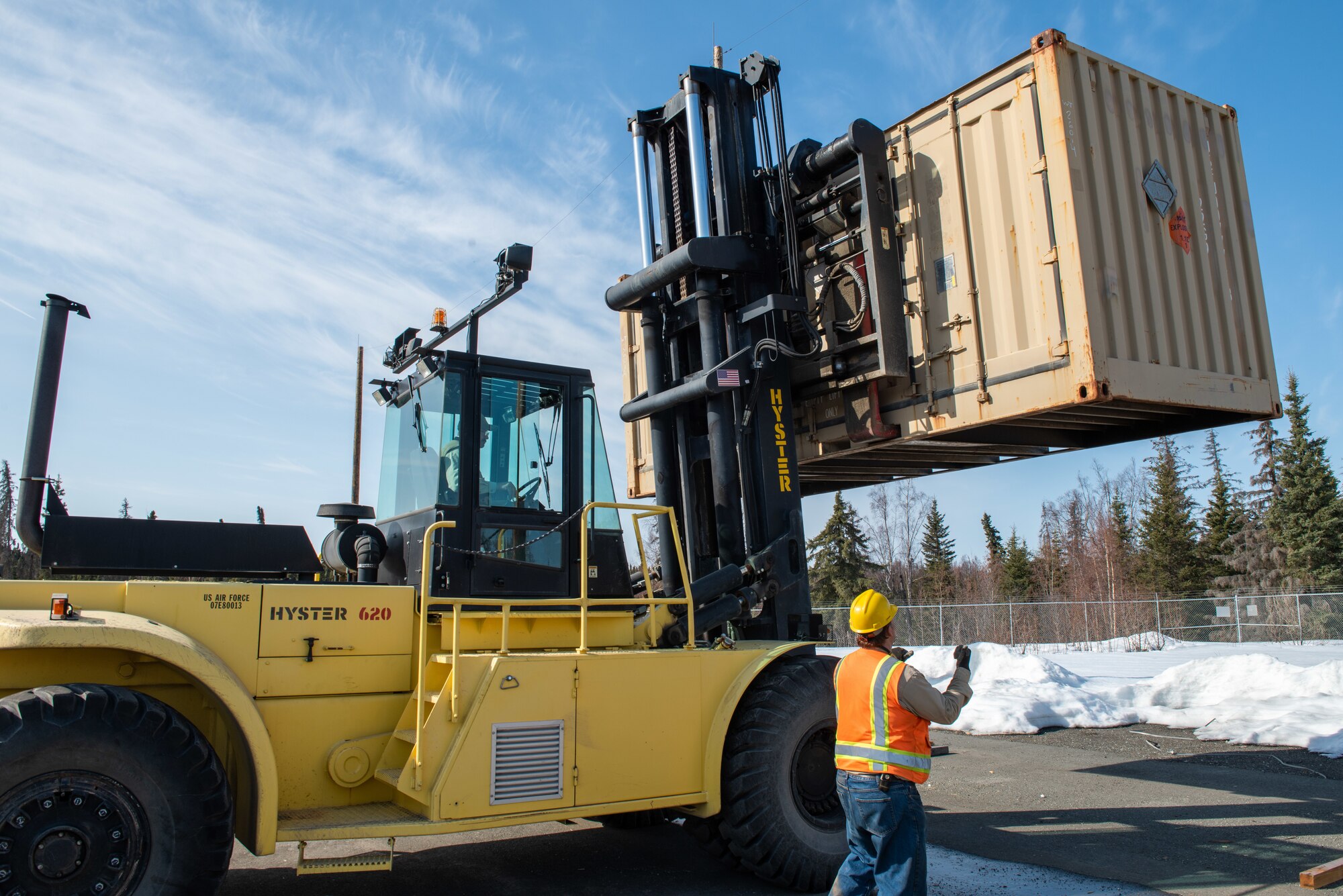 A photo of offloading a shipping container.